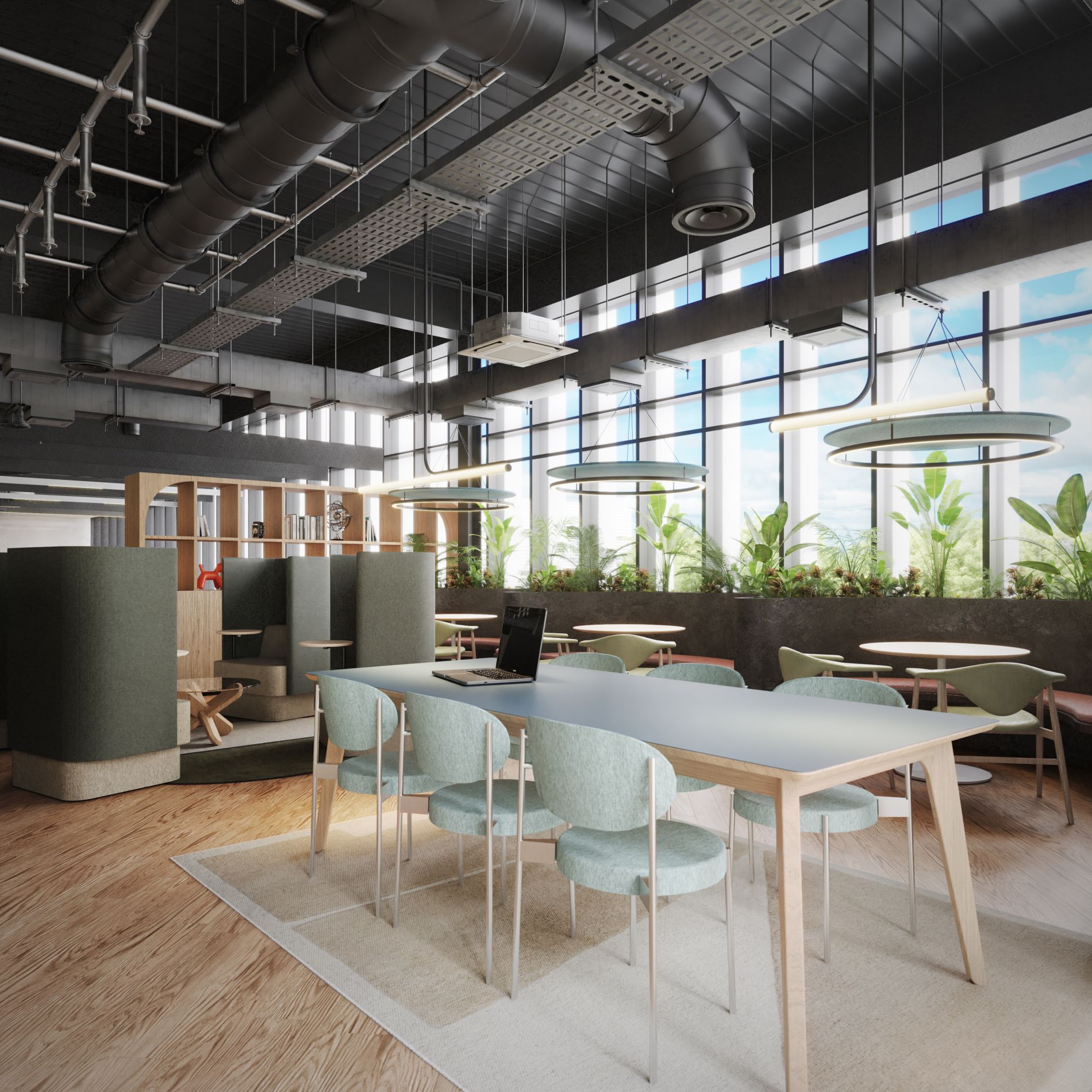 eating area in new game art studio with large windows, chairs, tables and plants